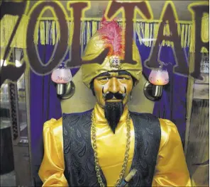  ??  ?? Characters Unlimited has become the leading producer of the Zoltar fortunetel­ler machine. They sell for $4,000 and take up to five weeks to make.