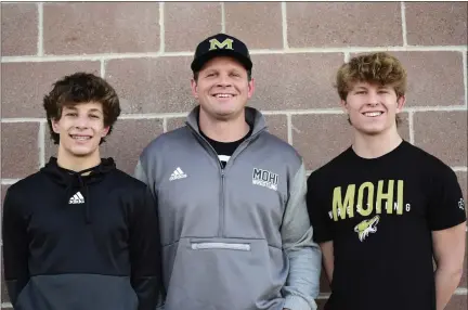  ?? BRENT W. NEW — BOCOPREPS.COM ?? From left: Levi, Brian and Wyatt Carlucci pose for a photo outside Monarch High School on Thursday in Louisville.