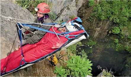  ??  ?? A caver, below, descends into Harwoods Hole, Nelson, where Mike Brewer, right, was involved in the rescue of a 25-year-old female climber, above, who was injured in the entrance to the cave system.