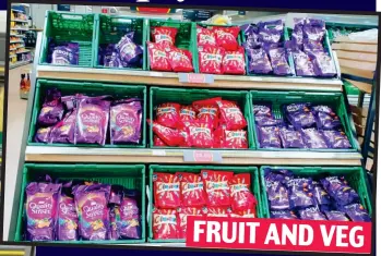  ?? ?? FRUIT AND VEG Five a day? Chocolates in fruit and veg boxes in Hertfordsh­ire Co-op