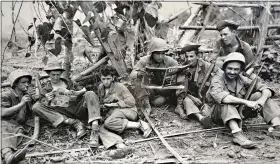  ?? (U.S. Army Signal Corps via AP, File) ?? This Aug. 2, 1944, photo, courtesy of the U.S. Army Signal Corps, shows members of the famed Wolrd War II Army unit Merrill's Marauders fewer than 75 yards from enemy positions. The unit, which spent months marching and fighting behind enemy lines in Burma, has been approved to receive the Congressio­nal Gold Medal. Nearly 3,000 soldiers began the unit's secret mission in Japanese-occupied Burma in 1944. Barely 200 remained in the fight when their mission was completed five months later.