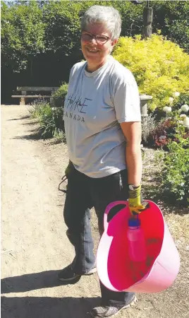  ?? SARA WILLIAMS ?? Bernadette Vangool in one of her favourite spaces — the Heritage Rose Garden at the Saskatoon Forestry Farm Park & Zoo.