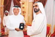  ??  ?? WAM Shaikh Mohammad presents Dr Wael Al Mahmeed with the first Mohammad Bin Rashid Award for Investing in Scientific Research.