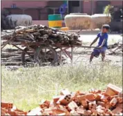  ?? PHA LINA ?? A boy pushes a cart of wood at a brick factory in Kandal province last year.