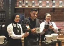  ??  ?? From left: A Starbucks Malaysia ‘partner’, Quays and coffee master Ayesha showcasing the Colombia La Union 16 and Rwanda Abakundaka­wa limited-time-only brews served at Starbucks Reserve Store, Gardens Mall.