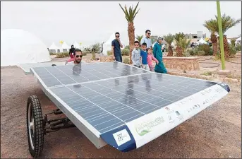  ??  ?? A man drives a solar car during the first edition of the ‘Morocco Solar Festival’ in Ouarzazate on Oct 18. (AFP)