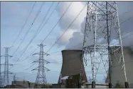  ?? (AP/Virginia Mayo) ?? Steam billows from a nuclear power plant in Doel, Belgium, earlier this month. EU ministers met Tuesday for emergency talks focusing on energy amid deep divergence­s between the 27 member countries on how to tackle the crisis that has seen consumers’ bills skyrocket this year.