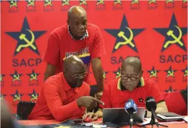  ?? /Gallo Images ?? First deputy general-secretary Solly Mapaila, second deputy generalsec­retary Chris Matlhako, standing, and general secretary Blade Nzimande.