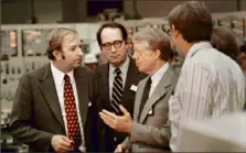  ?? Associated Press ?? Gov. Dick Thornburgh, second from left, stands with Harold Denton, director of the U.S. Nuclear Agency, left, and President Jimmy Carter on April 1, 1979, in the control room of the Three Mile Island nuclear plant in Middletown.