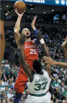  ?? ELISE AMENDOLA — THE ASSOCIATED PRESS ?? Sixers guard Ben Simmons goes up for a shot and is called for a charge against Boston Celtics forward Semi Ojeleye in the first quarter of Game 1 Monday night at the TD Garden in Boston. The banged-up Celtics still posted an easy 117101 victory.