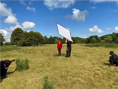  ??  ?? From a distance: Esquire’s Simon Emmett photograph­s Josh O’Connor, wearing Prada, at Hexton Manor,
Hertfordsh­ire, in June, while Tom Frimley perfects lighting and Dan Choppen watches on