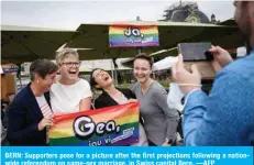  ?? ?? BERN: Supporters pose for a picture after the first projection­s following a nationwide referendum on same-sex marriage, in Swiss capital Bern. —AFP