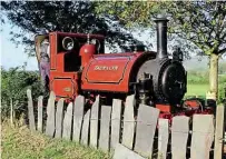  ??  ?? Above: The slate transfer siding at Wharf station. IAN DRUMMOND
Right: Fletcher Jennings 0-4-2ST No.1 Talyllyn behind the historic slate fencing. IAN DRUMMOND