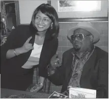  ??  ?? Fort Washington resident Brenda Robinson, a producer of funkateer events, poses with George Clinton at Lefty’s BBQ in Waldorf on Wednesday.