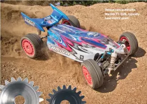  ??  ?? Tamiya cars and trucks, like this TT-02B, typically have metric gears. Both of these gears have 21 teeth; the silver gear is “metric 48 pitch” and is noticeably larger than the standard 48 pitch gear.