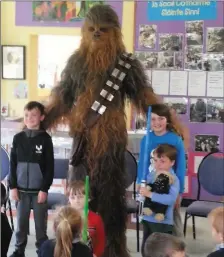  ??  ?? The pupils of Scoil an Fheirteára­igh in Ballyferri­ter got a special treat when Chewbacca dropped by to say hello.