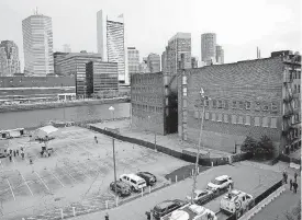  ?? [AP PHOTOS] ?? The Boston skyline forms a backdrop at the site of General Electric’s new headquarte­rs Monday before a groundbrea­king ceremony.