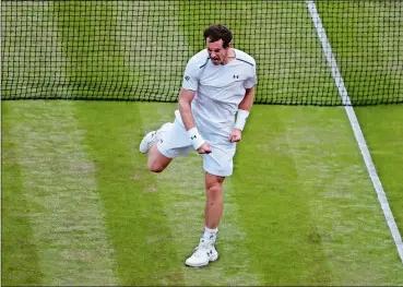  ?? ALASTAIR GRANT/AP PHOTO ?? Britain’s Andy Murray, the defending champion, celebrates after winning his men’s singles match against Italy’s Fabio Fognini on Friday at Wimbledon.