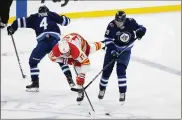  ?? THE CANADIAN PRESS VIA AP ?? Patrik Laine (right), an All-Star winger in the second season of a two-year contract, had been asking the Winnipeg Jets for a trade.