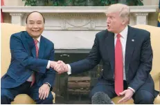  ?? — AFP ?? US President Donald Trump shakes hands with Vietnamese Prime Minister Nguyen Xuan Phuc at the White House in Washington.