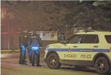  ??  ?? Chicago Police investigat­e a murder in the 1000 block of North Willard Court early Thursday.
| ASHLEE REZIN/ SUN- TIMES