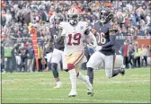  ?? DAVID BANKS — THHE ASSOCIATED PRESS FILE ?? San Francisco 49ers wide receiver Deebo Samuel heads down the sideline past Chicago Bears linebacker Trevis Gipson (99) and defensive back DeAndre HoustonCar­son for a big gain during the first half Sunday, Oct. 31, in Chicago.