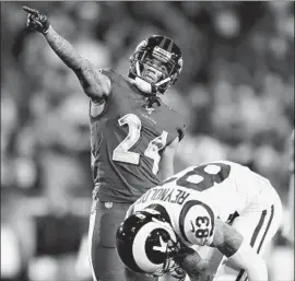  ?? Wally Skalij Los Angeles Times ?? MARCUS PETERS, who picked off a pass Monday night, taunts Josh Reynolds and his former team after a penalty in the fourth quarter at the Coliseum.