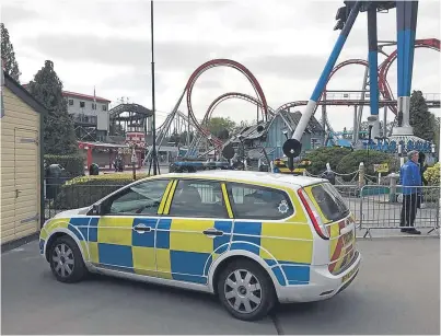  ?? Picture: PA. ?? A police car at the theme park yesterday after an 11-year-old girl died.