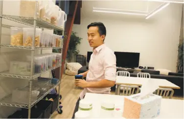  ?? Lea Suzuki / The Chronicle ?? Ted Wu, a software engineer, walks past a gaming area on the way to a kitchen while working at Chartboost in San Francisco. The company has about 120 employees.