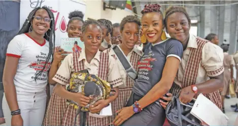  ??  ?? It’s all love with Herflow Foundation Founder Shelly-ann Weeks and Miss Imani Patricia from the GRASSROOTS Community Foundation as they interact with the students at the Invest In Girls Summit held at St. James High in partnershi­p with Herflow Foundation on April 15, 2019.