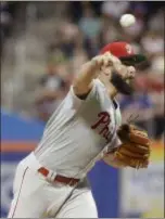  ?? FRANK FRANKLIN II — THE ASSOCIATED PRESS ?? Phillies starter Jake Arrieta delivers during the first inning against the Mets Saturday, an outing that lasted 4.1 rocky innings. The reason for Arrieta’s recent struggles, it was revealed Sunday, is a bone spur in his elbow.