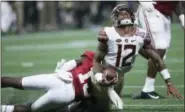  ?? JOHN BAZEMORE — THE ASSOCIATED PRESS ?? Alabama defensive back Ronnie Harrison (15) hits Florida State quarterbac­k Deondre Francois (12) during the second half Saturday. Francois suffered a season-ending injury on the play, crushing FSU’s national title hopes.