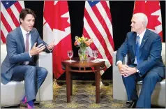  ?? CP PHOTO RYAN REMIORZ ?? Prime Minister Justin Trudeau meets with American VicePresid­ent Mike Pence Friday at the National Governor's Associatio­n Special Session — Collaborat­ing to Create Tomorrow’s Global Economy, in Providence, R.I.