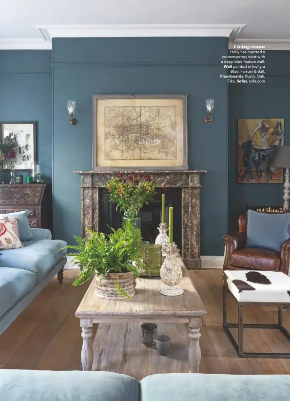  ??  ?? Living room
Holly has injected a contempora­ry twist with a deep blue feature wall. Wall painted in Inchyra Blue, Farrow & Ball. Floorboard­s, Rustic Oak, Elka. Sofas, sofa.com