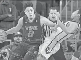  ?? Mark J. Terrill Associated Press ?? UTAH GUARD Sedrick Barefield barrels past USC guard Derryck Thornton in the first half. Barefield scored 13 points in the Utes’ victory at Galen Center.