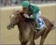  ?? ELSA LORIEUL/NYRA ?? Code of Honor with hall of fame jockey John Velazquez up broke from the back of the pack and was hand ridden to the Dwyer Stakes victory Saturday afternoon at Belmont Park.