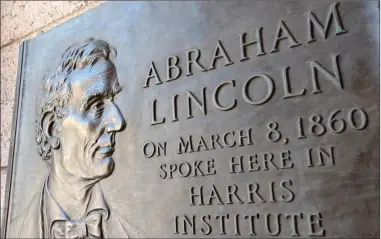  ?? Photo by Russ Olivo ?? A plaque at Harris Hall commemorat­es the March 8, 1860 visit by Abraham Lincoln, when the then up-and-coming Republican visited the city to campaign for his party’s congressio­nal candidates. The city is now seeking proposals for a statue near the site...