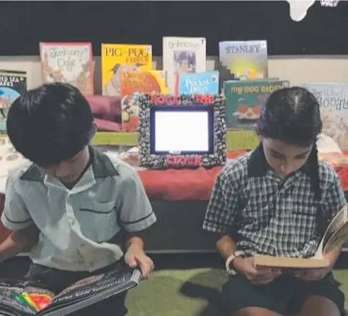  ??  ?? TIME’S RIGHT: St Francis Xavier Year 4 students Shoryu Shin and Kelsey Busuttil love their reading.