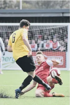  ??  ?? Tom White gets stuck in, above, while, below, Jimmy Beadle shows his joy after his goal