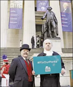  ??  ?? Actors playing Teddy Roosevelt and George Washington take part in protest outside Federal Hall Saturday seeking more funding to maintain National Park sites in New York.