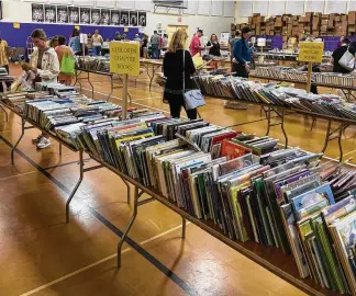  ?? AMY BURZYNSKI / STAFF ?? The Friends of the Hamilton-Fairfield Lane Libraries held their Annual Used Book Sale May 4-6 in the gymnasium at Queen of Peace Parish. Proceeds benefit the Friends of the Libraries.