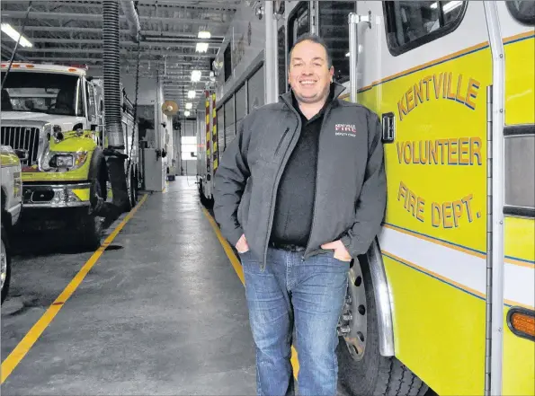  ?? SARA ERICSSON ?? Second deputy fire chief Scott Hamilton stands with the firetrucks in the bay area of the department. He and other department members will be at the Feb. 28 area rate meeting, held at 7 p.m. inside the hall’s auditorium.