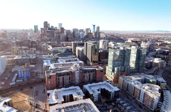  ?? Photos by Hyoung Chang, The Denver Post ?? The sun shines on downtown Denver on March 23. Federal distributi­ons flowed most freely to the places that had the most people and economic activity, a case of dollars following density. Around 44% of federal pandemic dollars went to the state’s three most populated counties — Denver, Arapahoe and El Paso.