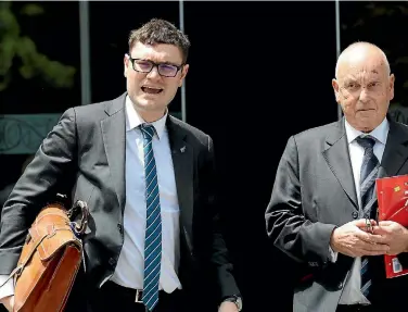  ?? PHOTOS: CAMERON BURNELL/STUFF ?? Taxpayers’ Union co-founder Jordan Williams and his lawyer, Peter McKnight, leave the Court of Appeal yesterday where both sides found fault with the High Court result.