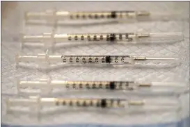  ?? NAM Y. HUH — THE ASSOCIATED PRESS ?? Prepared COVID-19 Pfizer-BioNTech vaccine syringes are seen at Edward Hospital in Naperville, Ill.