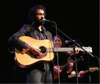  ?? CITIZEN FILE PHOTO ?? Raghu Lokanathan plays guitar during The First Waltz on Nov. 15, 2015, at the Prince George Playhouse.