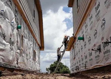  ?? Jon Shapley / Staff photograph­er ?? Homes under constructi­on in the Grand Trails subdivisio­n in Richmond are priced starting in the high $200,000s. Sales of new homes account for about 18 percent — or more than 1,700 — of the deals in May.