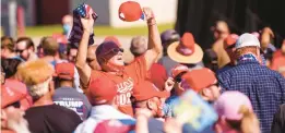  ?? MELISSA SUE GERRITS/GETTY ?? Supporters attend a campaign rally for then-President Donald Trump on Oct. 24, 2020, in Lumberton, N.C.