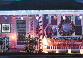  ?? MONICA CABRERA/THE MORNING CALL ?? Nichol Cafone, at 5685 Sullivan Trail in Nazareth, has been decorating since 2009. More lights are added every year, the current light count is over 28,000.