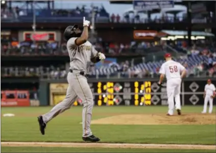  ?? MATT SLOCUM — THE ASSOCIATED PRESS ?? Pittsburgh’s Josh Bell reacts after hitting a two-run home run in the fourth inning. The Bucs’ first baseman also drove in the go-ahead run with a double in the eighth as the Pirates beat the Phillies, 6-3.